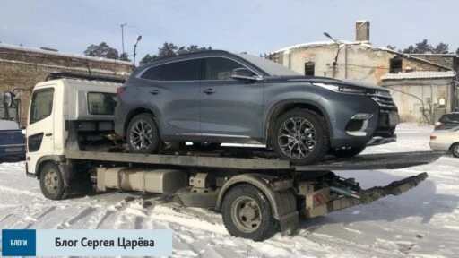 Exeed TXL на эвакуаторе