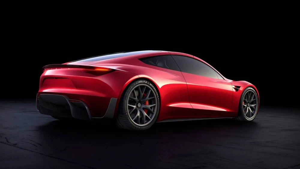 Электромобиль Tesla Roadster сбоку сзади