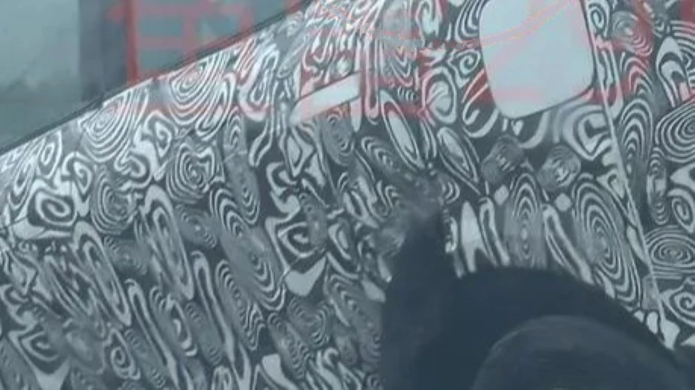 Тестовый кроссовер Omoda C7 сбоку