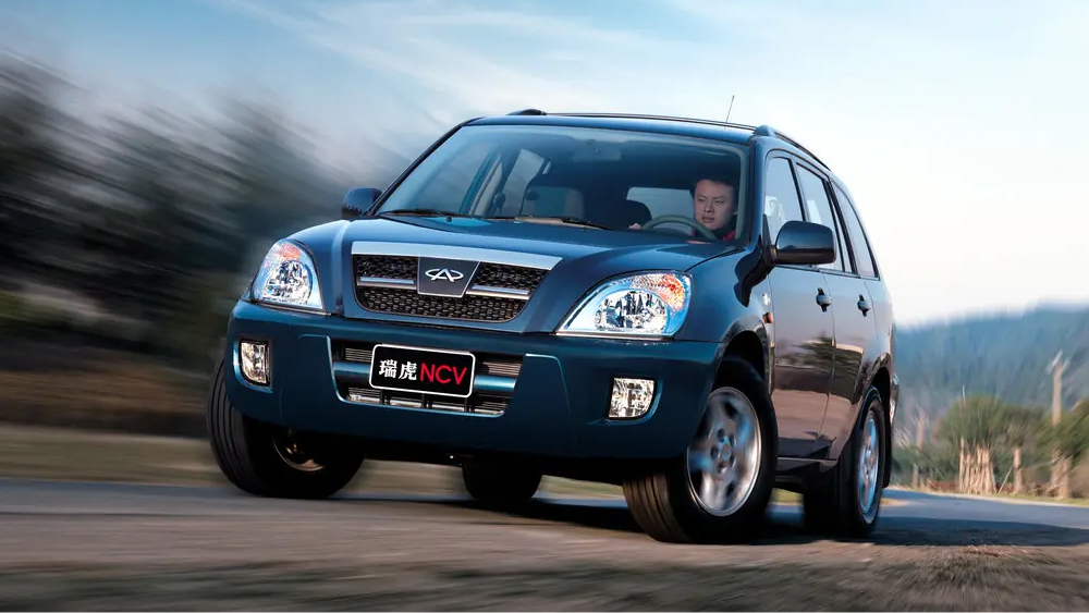 Chery Tiggo t11 сбоку спереди синий