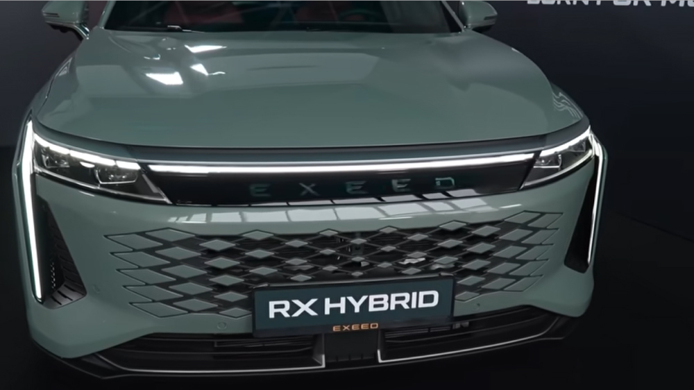 exeed rx hybrid гибридный кроссовер сбоку спереди зеленый презентация