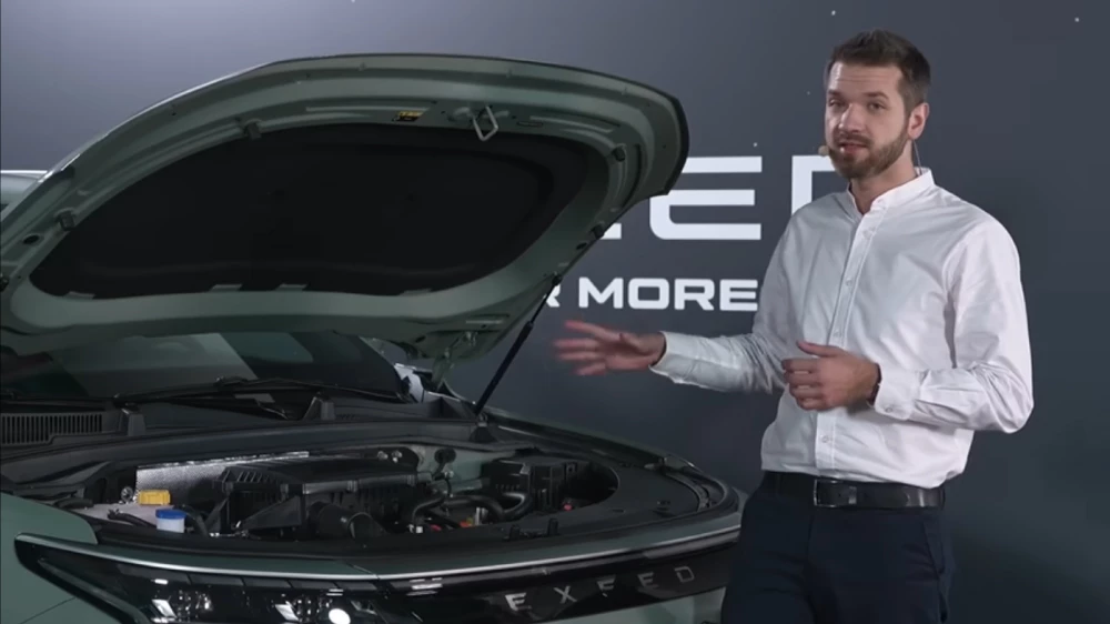 exeed rx hybrid гибридный кроссовер сбоку спереди зеленый презентация