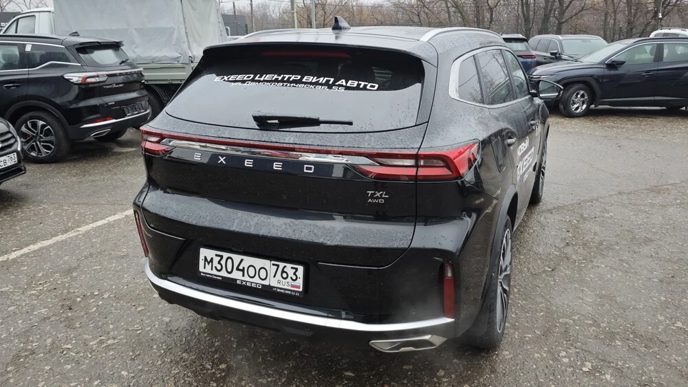 новый обновленный Exeed TXL тест-драйв обзор Сергея Мишина сбоку сзади