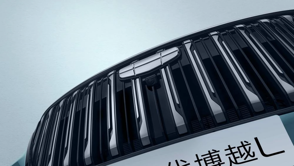 новый Geely Atlas четвертого поколения тизер фото спереди решетка