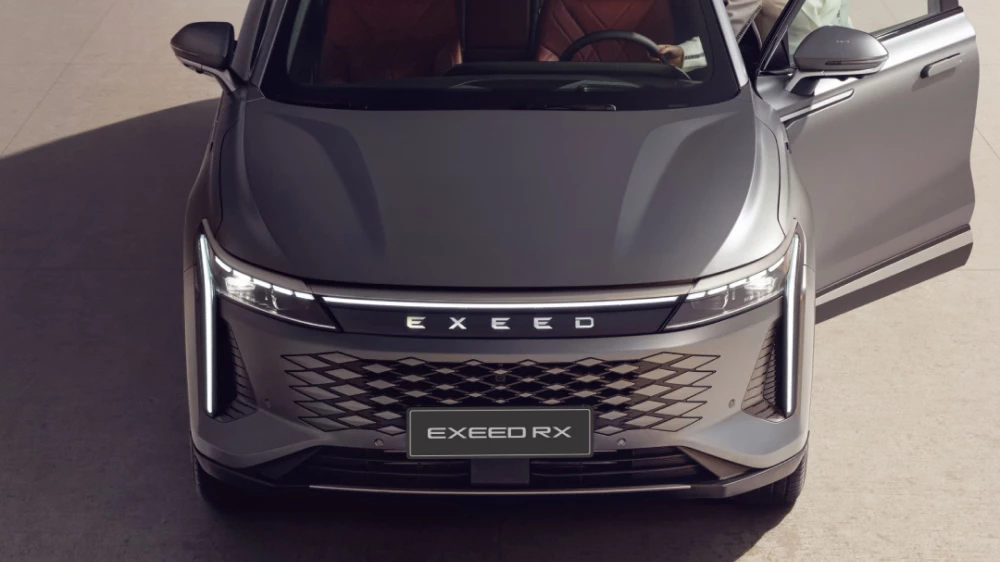 exeed rx купе-кроссовер обновили в казахстане спереди серый