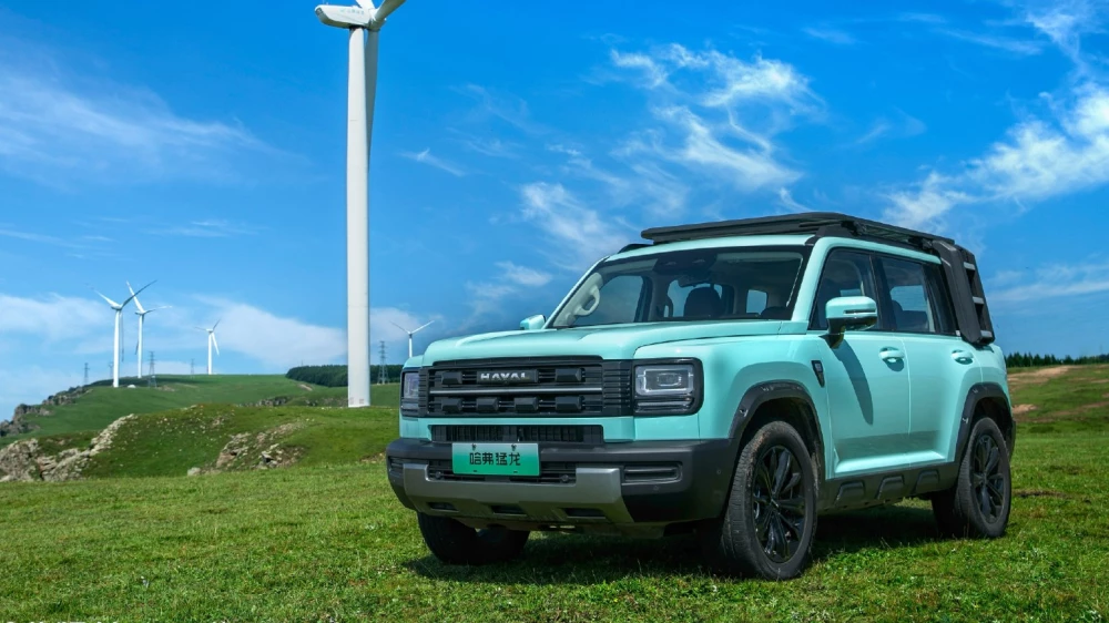 haval raptor hi4 обновленный 2026 модельного года гибридный кроссовер сбоку спереди бирюзовый