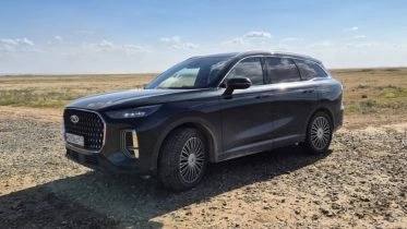 Chery Tiggo 9 андреев отпуск спереди сбоку в горах подкаст