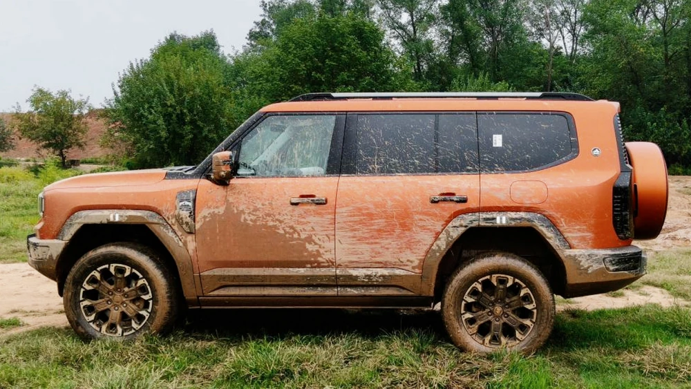 реальные отзывы плюсы минусы jetour g700 внедорожник сбоку гибридный оранжевый