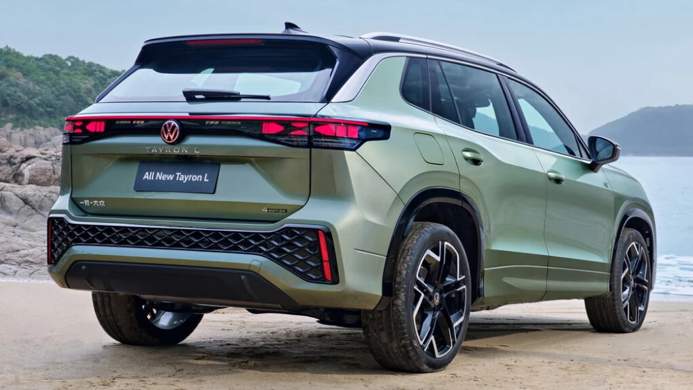 volkswagen tayron l сбоку сзади кроссовер зеленый