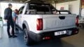 Дизельный пикап JAC T9 сзади сбоку у дилера в автосалоне Владивосток