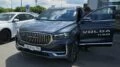 Кроссовер Volga K50 сбоку спереди у дилера в автосалоне тестовый Воронеж